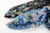 A multi-color floral sequin embroidery fabric on a black mesh base.
A multi-color floral sequin embroidery fabric on a sapphire blue mesh base.