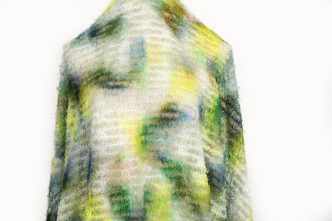 A 3D textured abstract embroidery fabric with a plush feel, in a palette of yellow, green, and blue.
