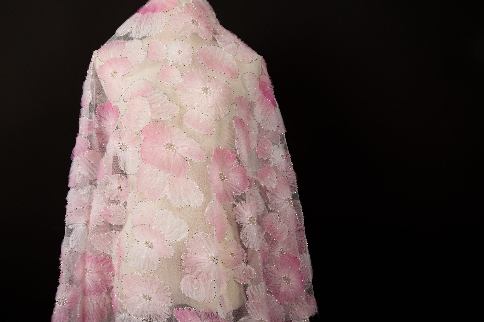  Peach, cream, and light pink crinkle ribbon embroidered floral fabric.