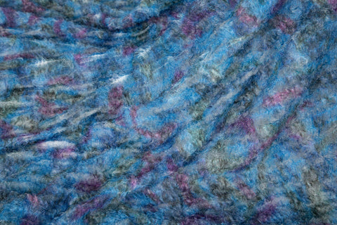 A 3D textured, plaid-patterned embroidery fabric with a plush feel, in a palette of various blues and teals.
