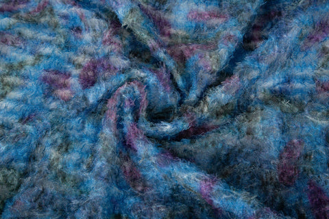 A 3D textured, plaid-patterned embroidery fabric with a plush feel, in a palette of various blues and teals.
