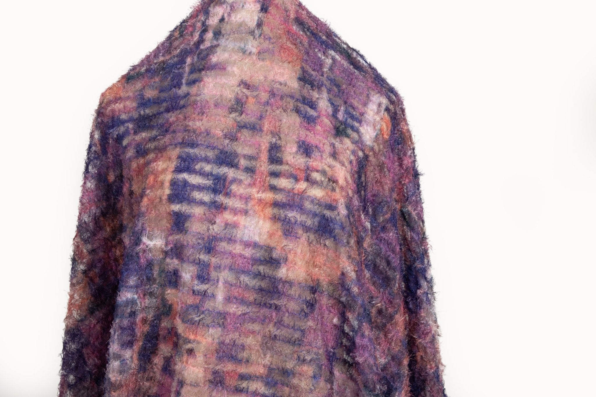  A 3D textured, plaid-patterned embroidery fabric with a plush feel, in a rich palette of purple, burgundy, and orange.
