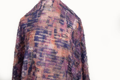  A 3D textured, plaid-patterned embroidery fabric with a plush feel, in a rich palette of purple, burgundy, and orange.
