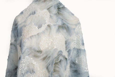  A 3D ribbon and beaded embroidery fabric in dusty blue.
