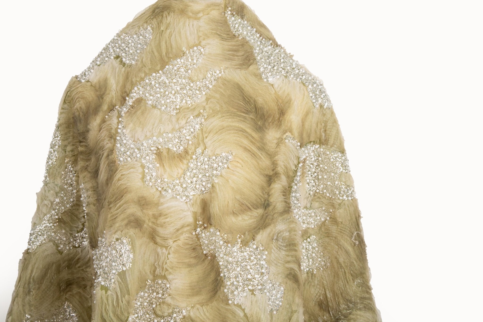 A 3D ribbon and beaded embroidery fabric in olive green.