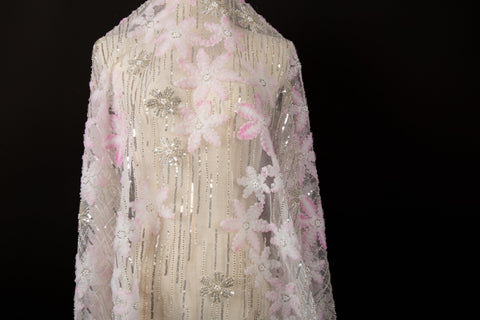 Pink 3D textured floral and silver sequin embroidery fabric.