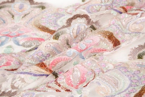 A luxurious sequin embroidery fabric, with a classic damask or brocade pattern in a soft, multi-color pastel palette.
