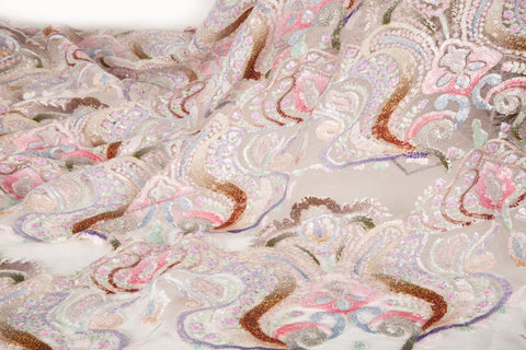 A luxurious sequin embroidery fabric, with a classic damask or brocade pattern in a soft, multi-color pastel palette.
