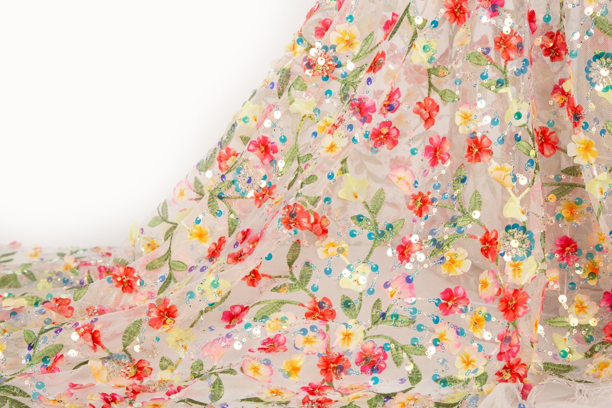 A 3D embroidery fabric with a multi-color wildflower pattern, embellished with sequins and beads.
